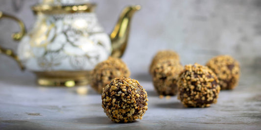 vegan chocolate truffles, topped with white chocolate, cocoa nibs, hazelnuts bite