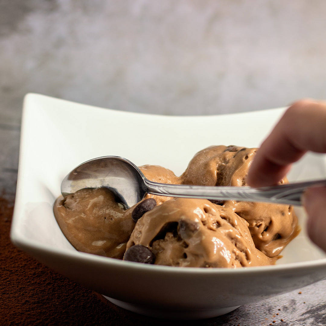 Vegan chocolate ice cream with chocolate chips. made from coconut and oats