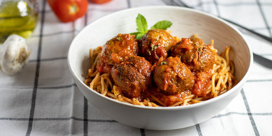 spaghetti with vegan meatballs and red tomato sauce